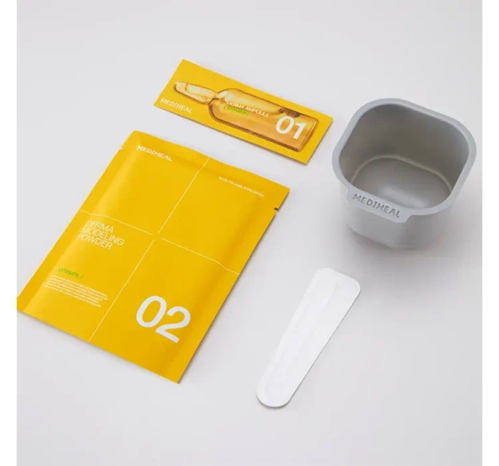 Kliknij na zdjęcie, aby je powiększyć Mediheal Derma Modeling Pack Vitamin Brightening Gesichtspflege-Set Algenmaske 28 g + Serum 2 ml