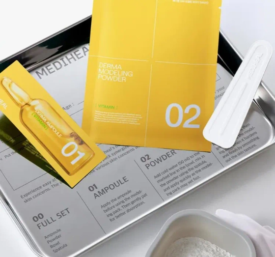 Kliknij na zdjęcie, aby je powiększyć Mediheal Derma Modeling Pack Vitamin Brightening Gesichtspflege-Set Algenmaske 28 g + Serum 2 ml